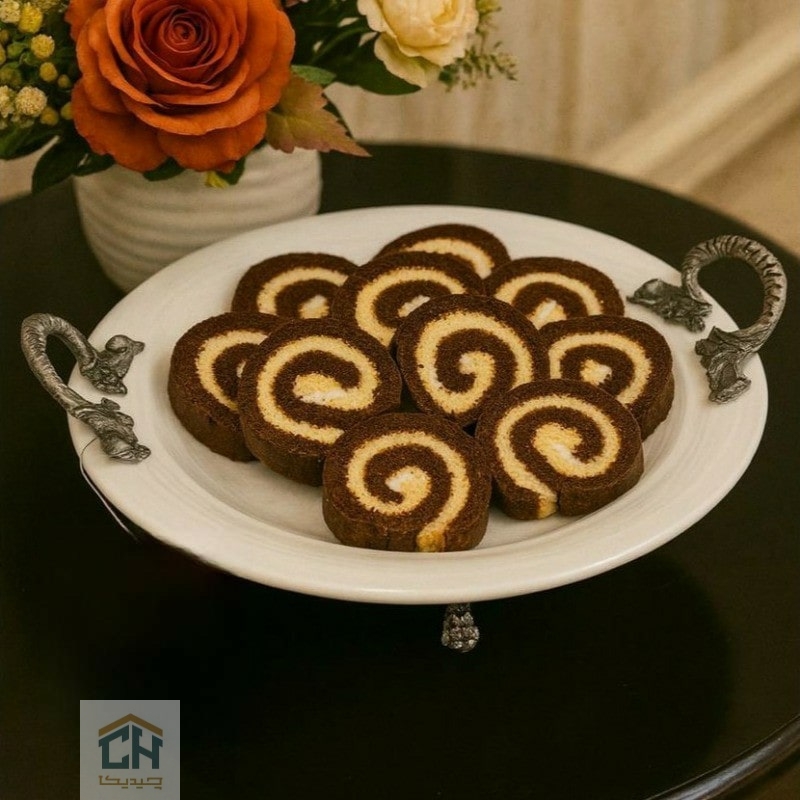 شیرینی خوری چینی دسته پیوتر مدل 80523 شیرینی خوری گرد دسته پیوتر با چیدمان رولت شکلاتی